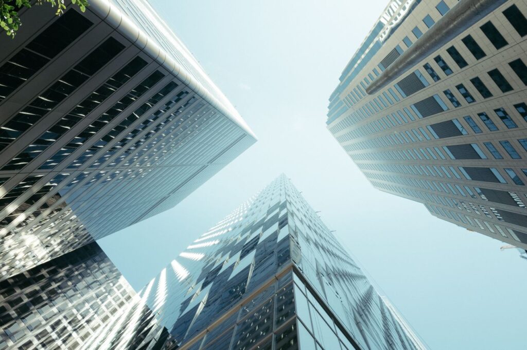 Low-angle capture of modern skyscrapers reaching towards the sky.